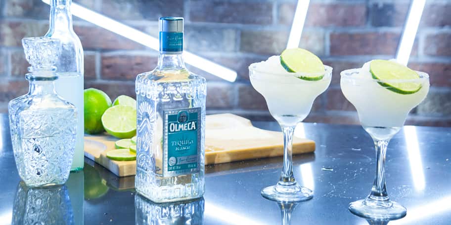 olmeca glass bottle and glasses, cocktails